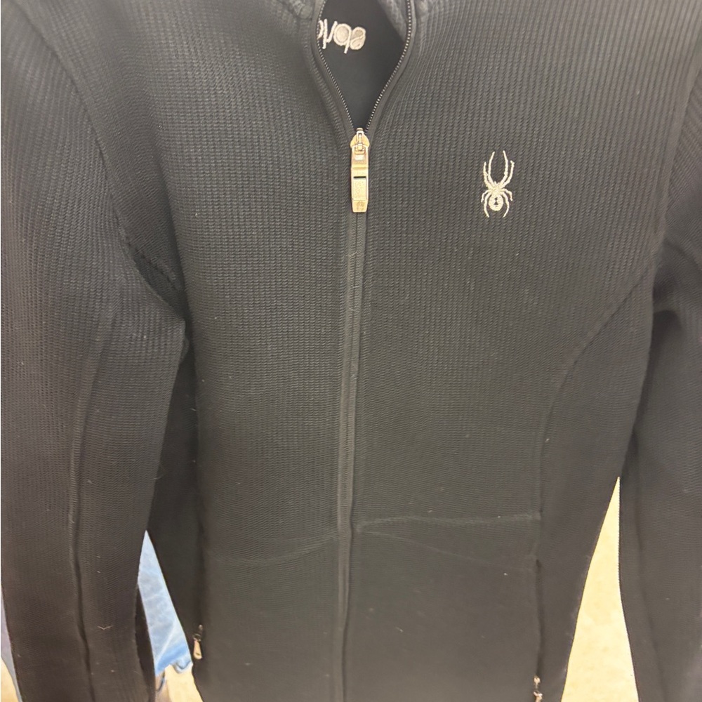Black Full-Zip core sweater Spyder Sz. L
Might be a few pills.